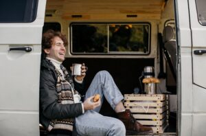 man-sitting-van-drinking-his-coffee